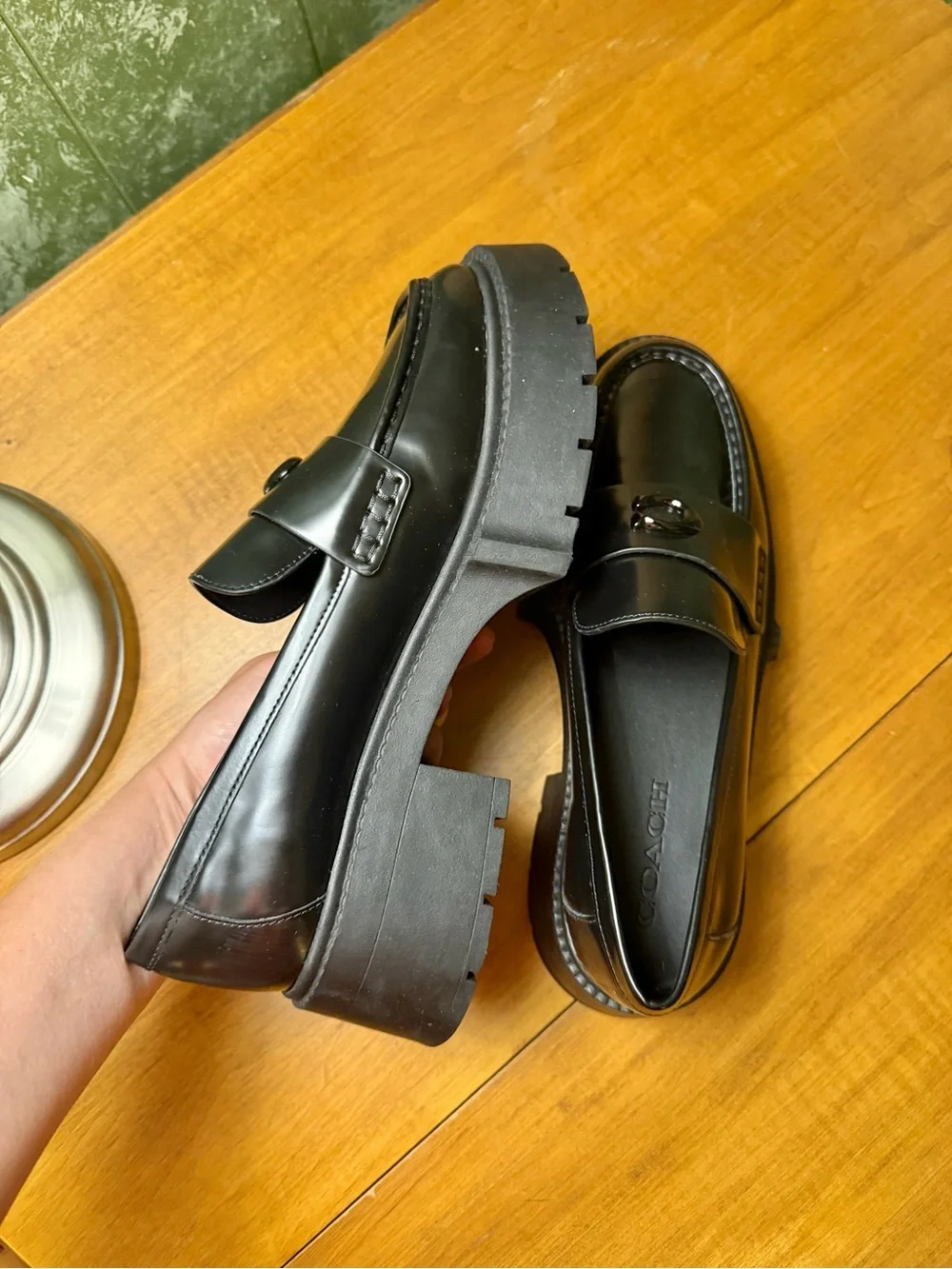 Coach polished black
